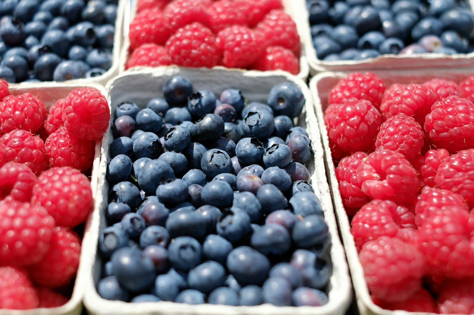 cartons of blueberries and raspberries.