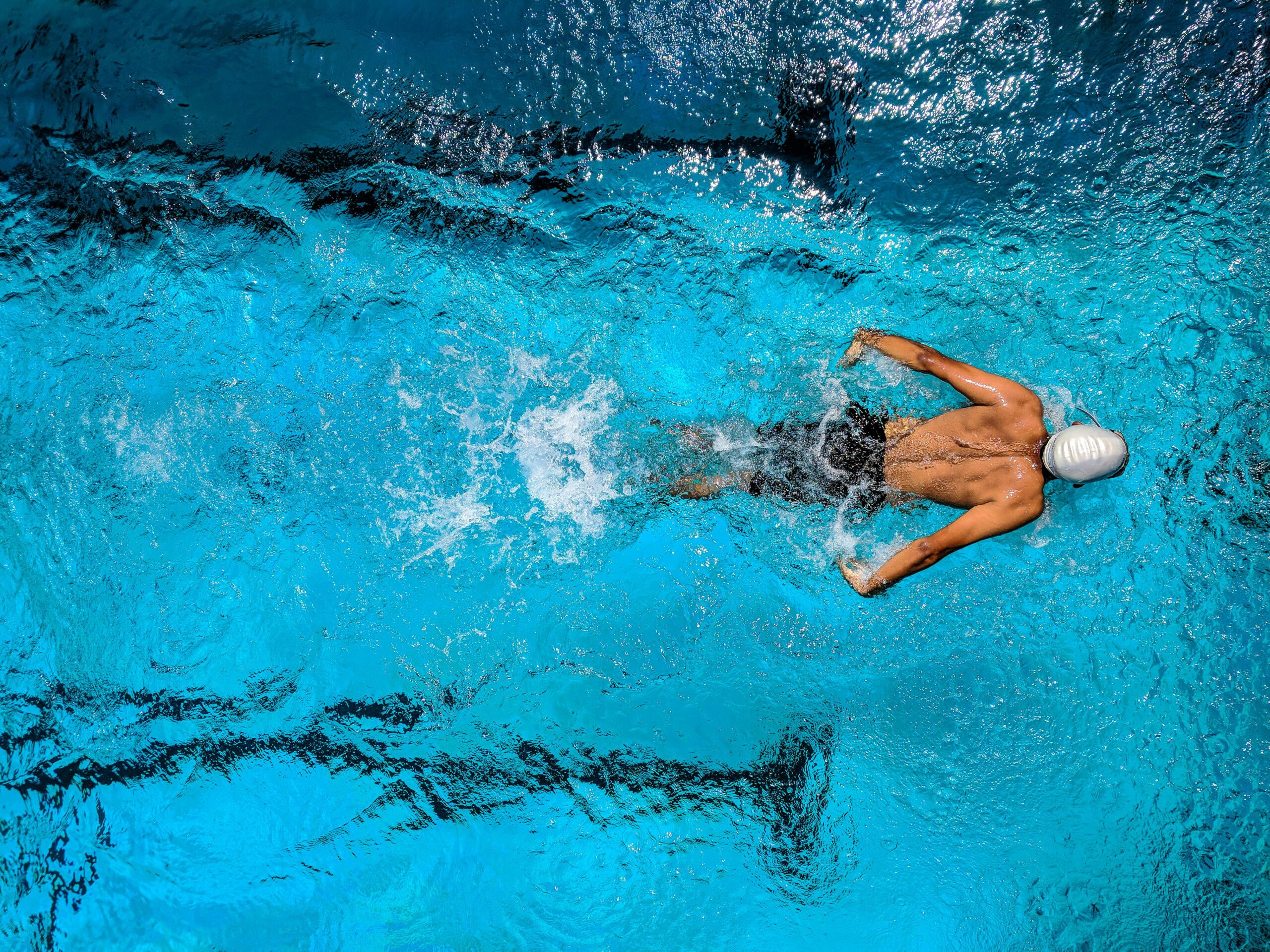 Overhead image of a swimmer swimming butterfly.